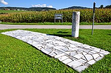 [1] Teil einer Römerstraße mit römischem Meilenstein, Gemeinde Moosburg (Kärnten)